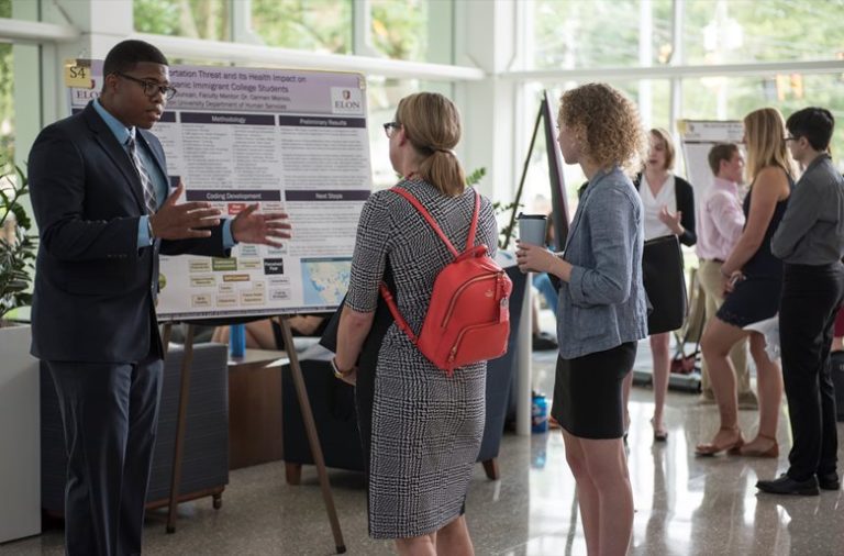 student (David Duncan) presents at a 2018 SURF day poster session