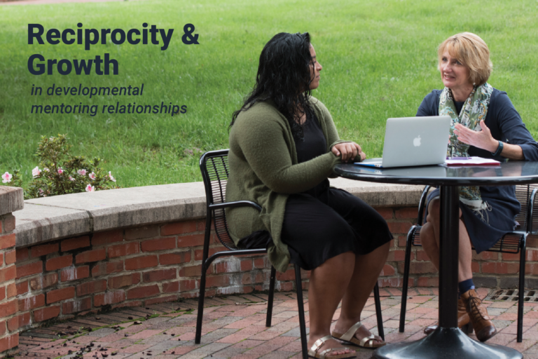 A professor and student sit at an outdoor table. Text on photo reads "Reciprocity and growth in developmental mentoring relationships"