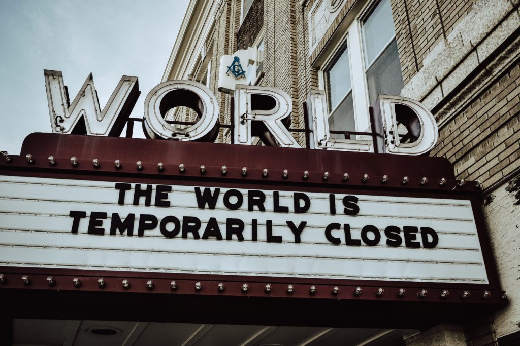 Marquee on "World" theatre that reads "The World is temporarily closed."