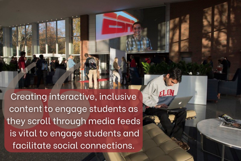 A large atrium with many windows, filled with students. A male student sits in the foreground, he wears an Elon sweatshirt and is looking down at a laptop."Creating interactive, inclusive content to engage students as they scroll through media feeds is vital to engage students and facilitate social connections."