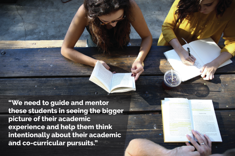 Three students work together at a picnic table; two are writing in notebooks, and another reads a book. A quote in the bottom left reads: "We need to guide and mentor those students in seeing the bigger picture of their academic experience and help them think intentionally about their academic and co-curricular pursuits."