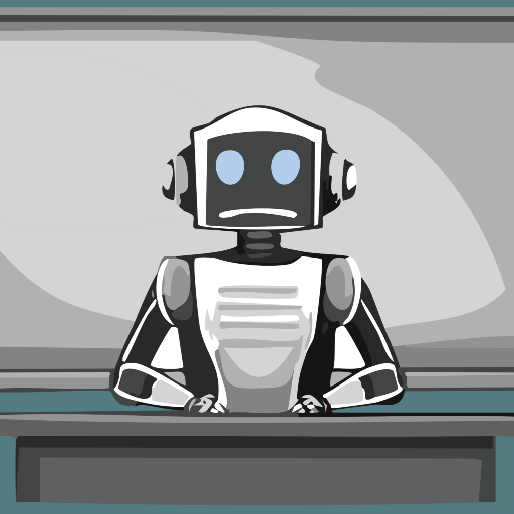Black and white robot sits behind teacher's desk in front of a classroom with chalkboard behind it. Robot has a slight frown.