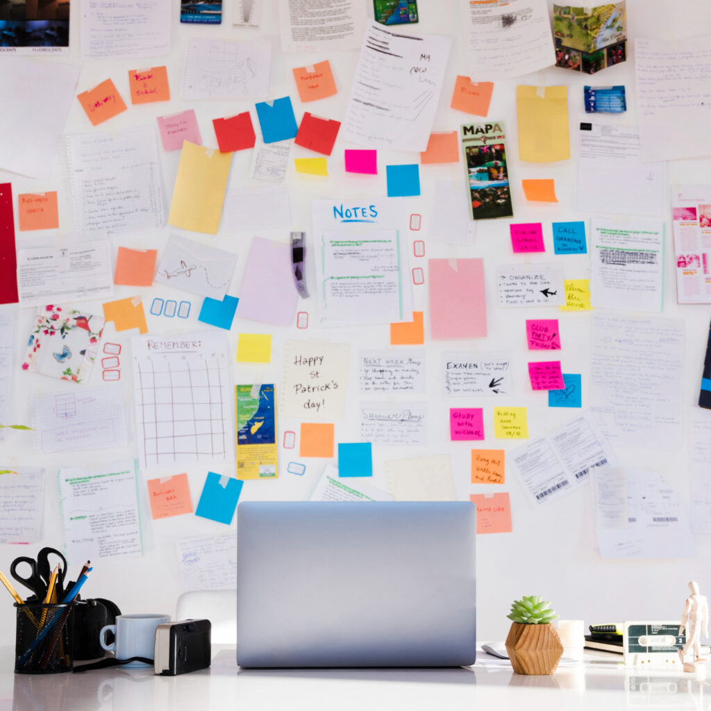 Messy bulletin board of notes.